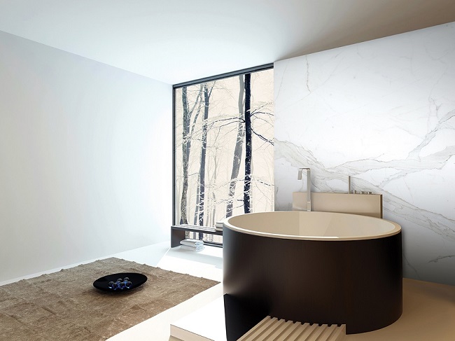 3D Rendering of Contemporary design luxury bathroom interior with a freestanding round brown bathtub against a beige tiled travertine wall with a corner floor-to-ceiling view window